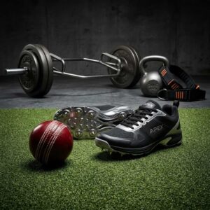 Cricket leather ball and bowling spikes next to gym trap bar and kettlebell for STRYVK Fast Bowler Coaching Program
